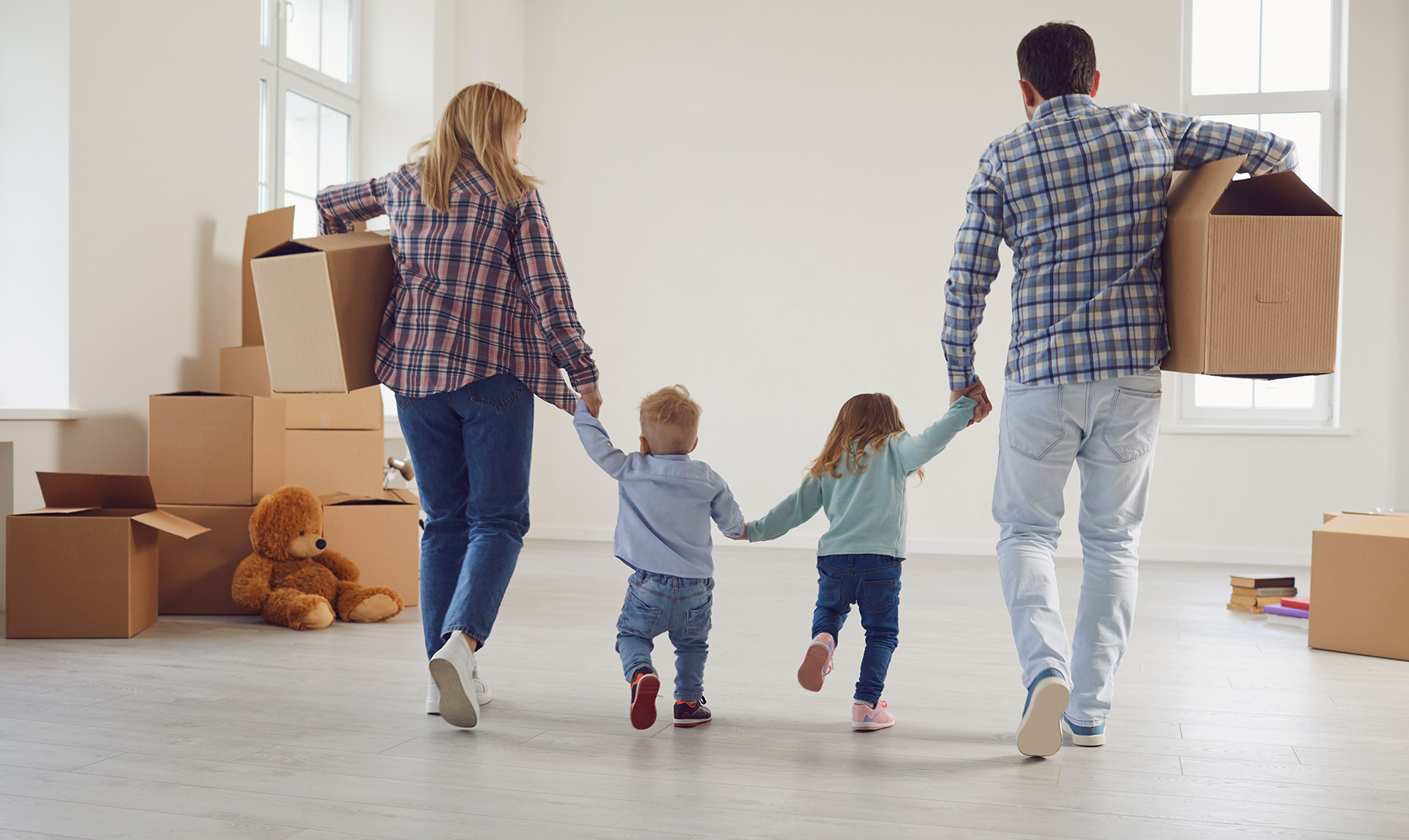 Happy family moving into their new home